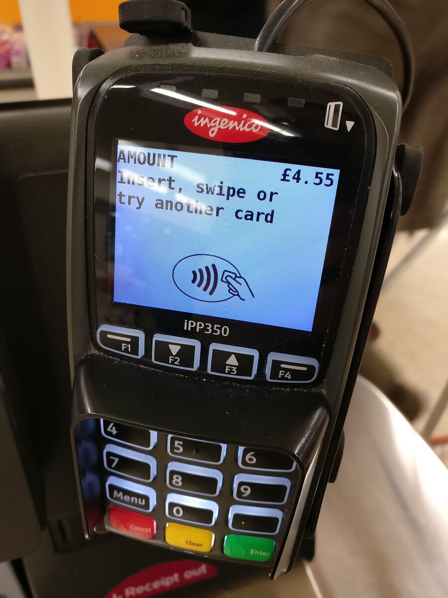 A payment terminal in a British shop (February 2017), asking to insert the card or try another one. An ordinary declined payment: the image illustrates dependence on payment networks, not an account freeze.