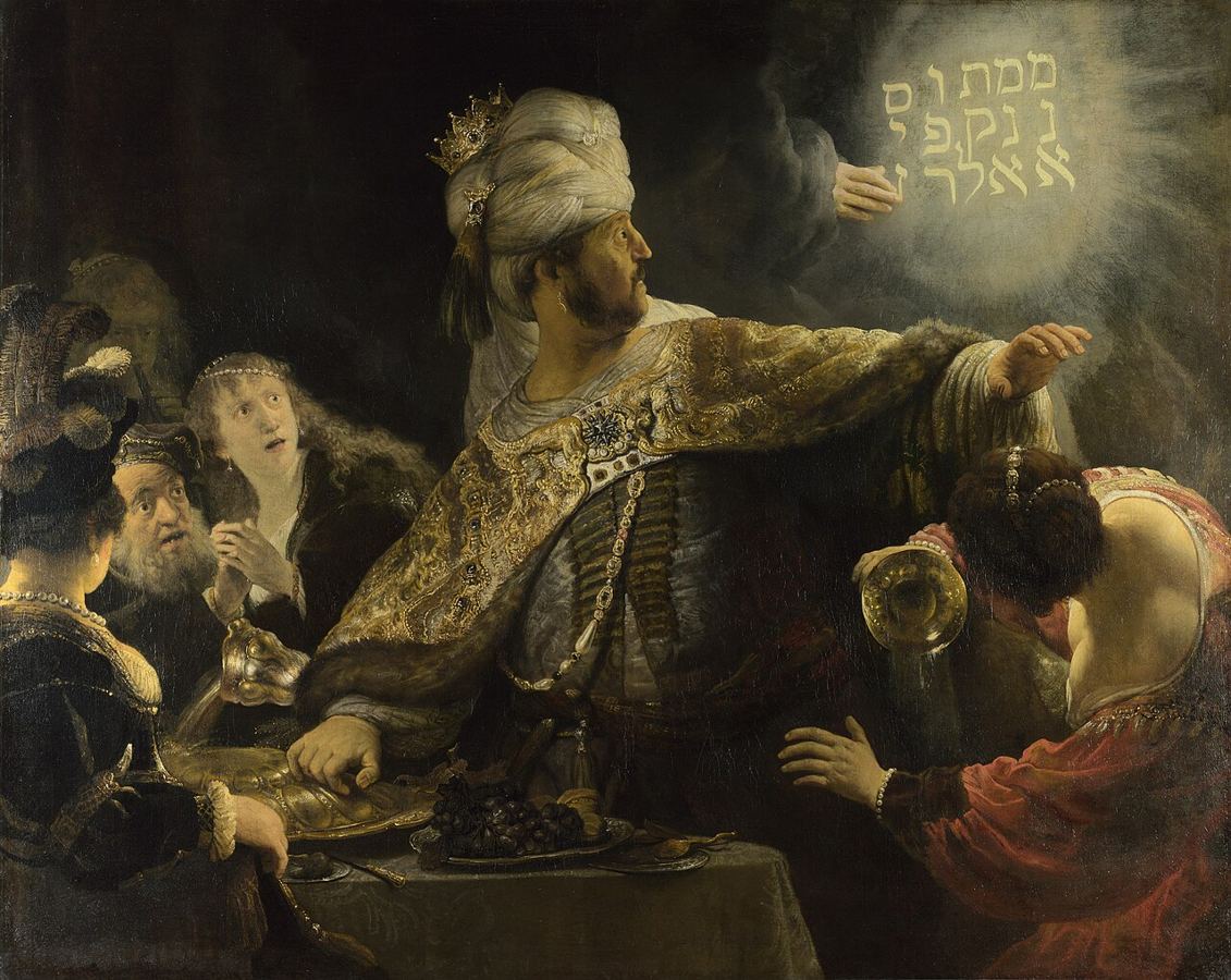 El festín de Baltasar, visión de artista de Rembrandt (hacia 1635-1638, National Gallery, Londres): la mano escribe en la pared.
